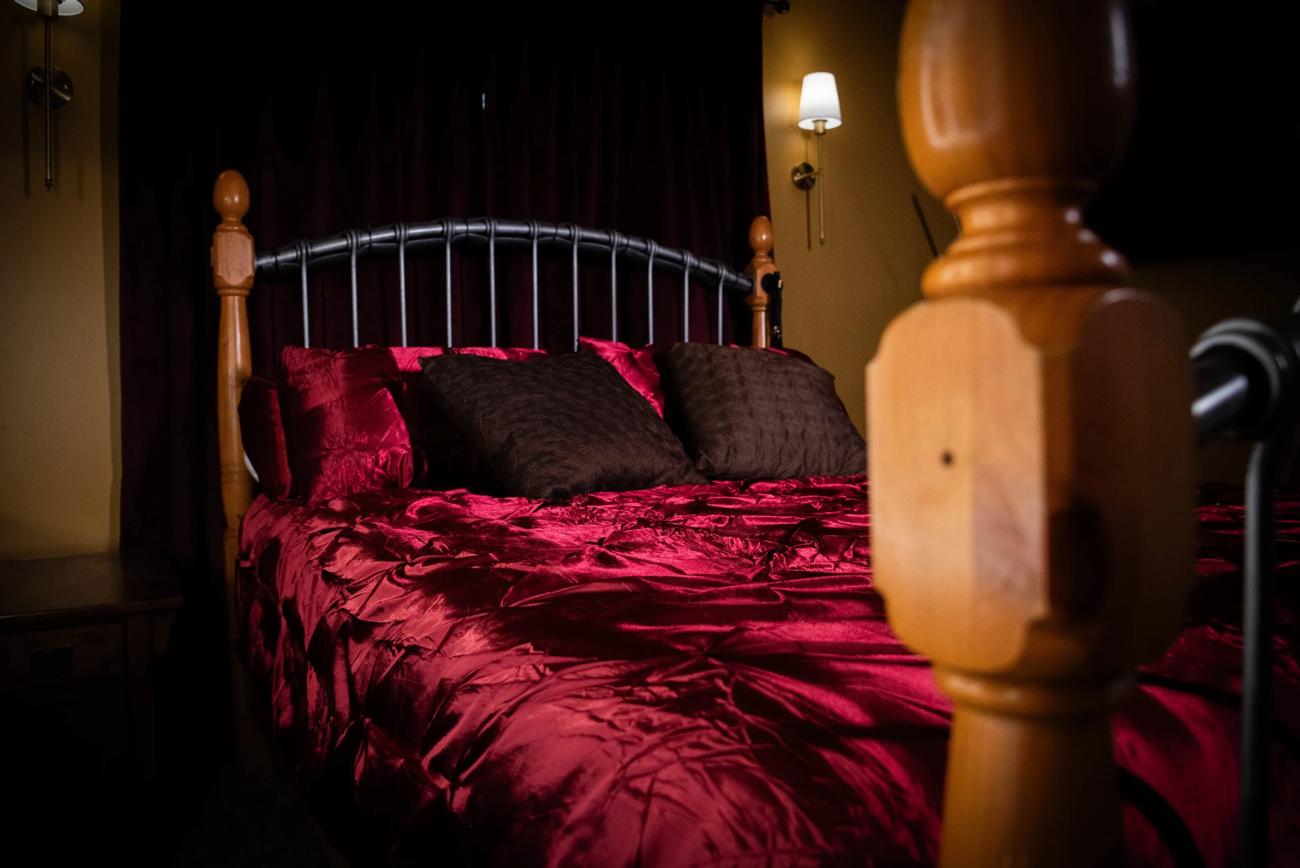 Queen bed and room setting inside The Original Sin